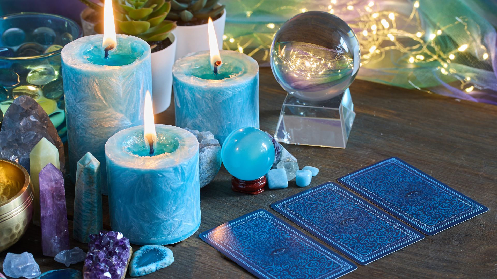 A group of candles sitting on top of a wooden table